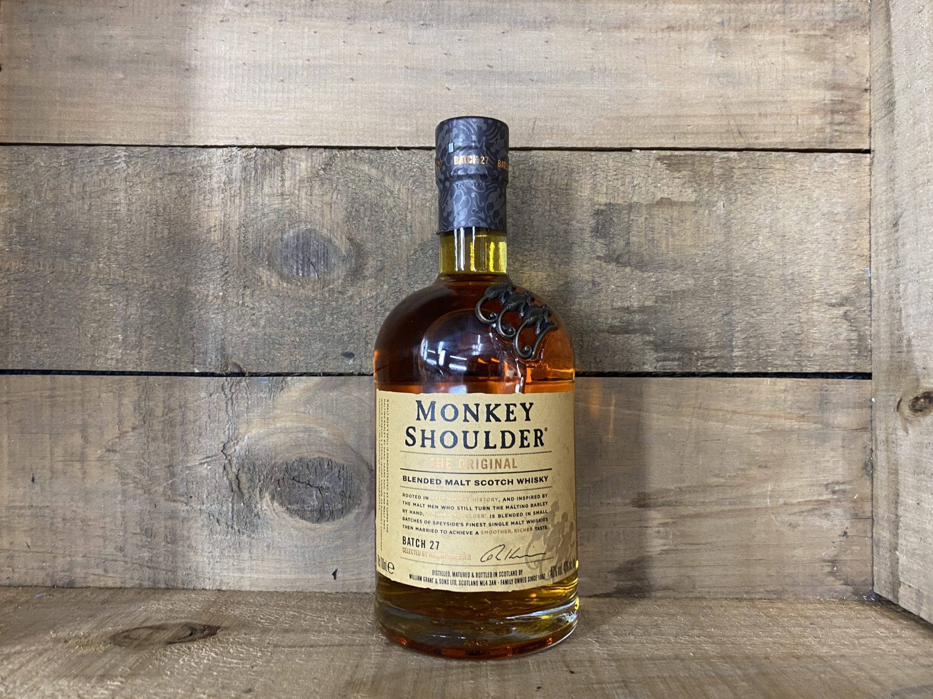 "Exquisite Monkey Shoulder Scotch Resting in a Rustic Wooden Crate" Wallpaper