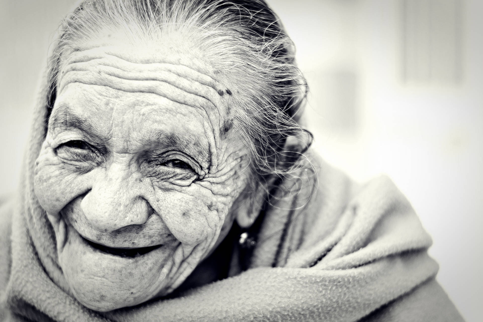 Elegant Aging Gracefully - A Monochrome Portrait of a Beautiful Older Woman Wallpaper