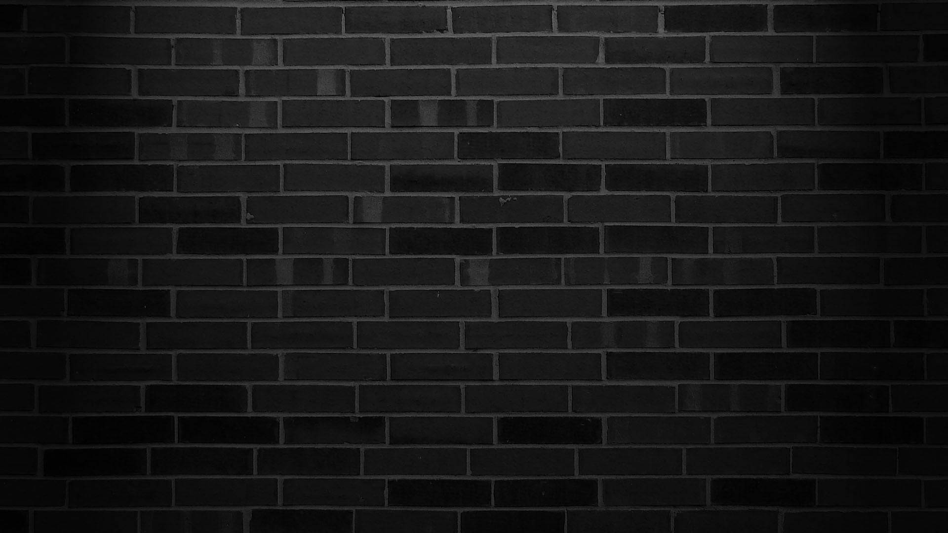Caption: Aesthetic Monochrome Dark Brick Wall Wallpaper