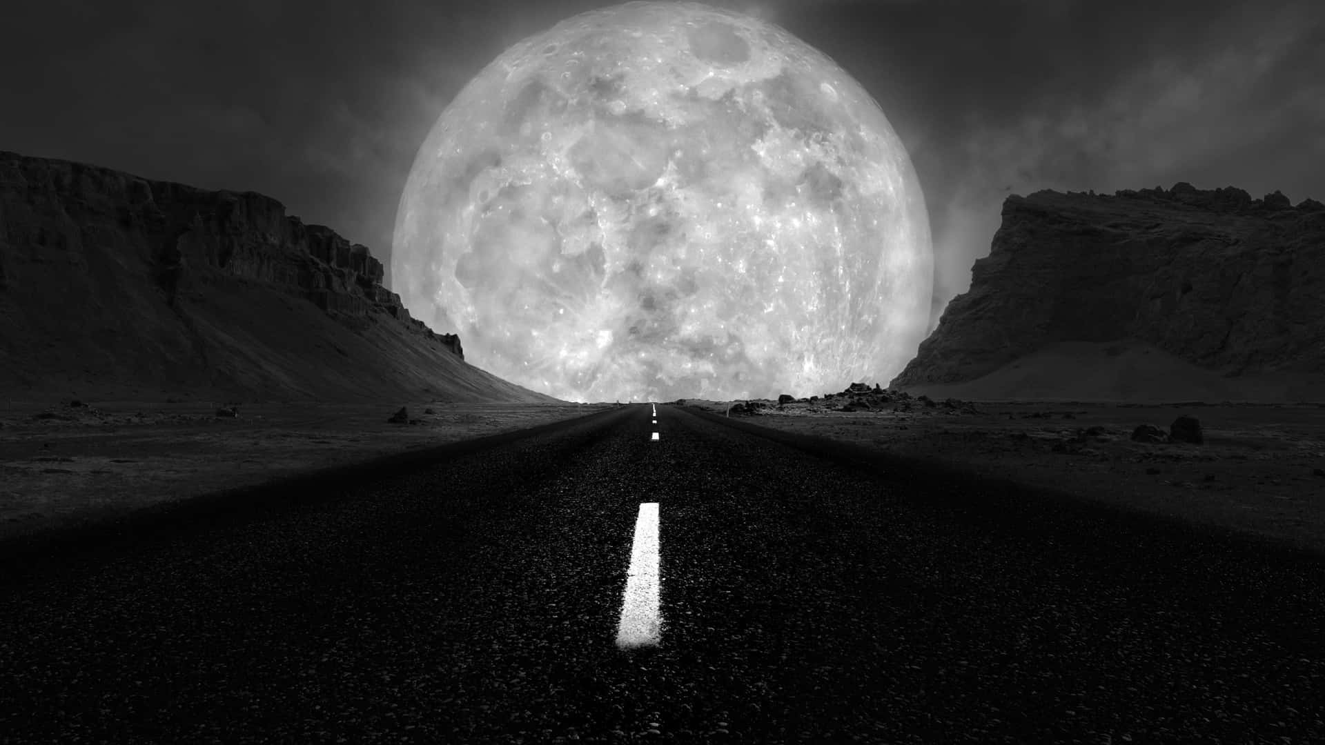 Monochrome_ Desert_ Road_ Under_ Giant_ Moon.jpg Wallpaper