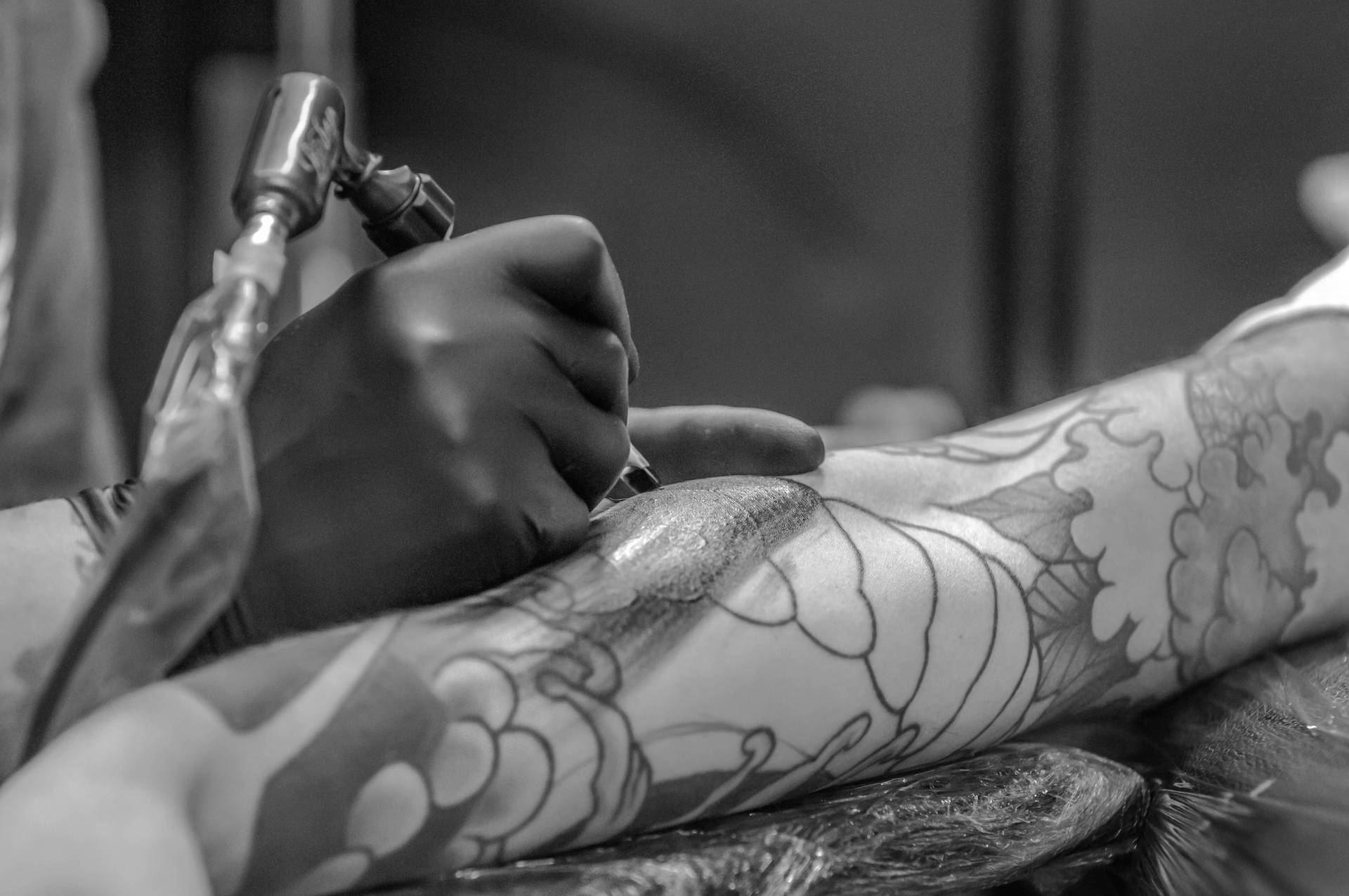 Intricate Artistry Behind the Monochrome HD Tattoo Process Wallpaper