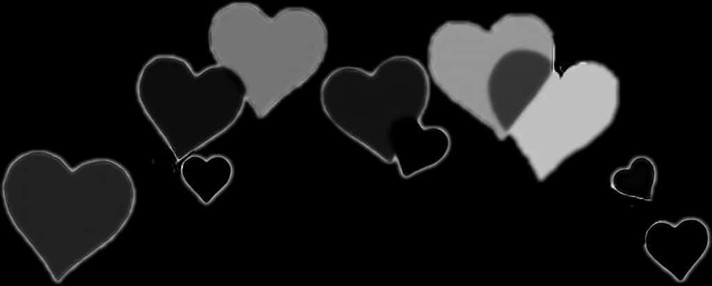 Monochrome Hearts Against Black Background PNG