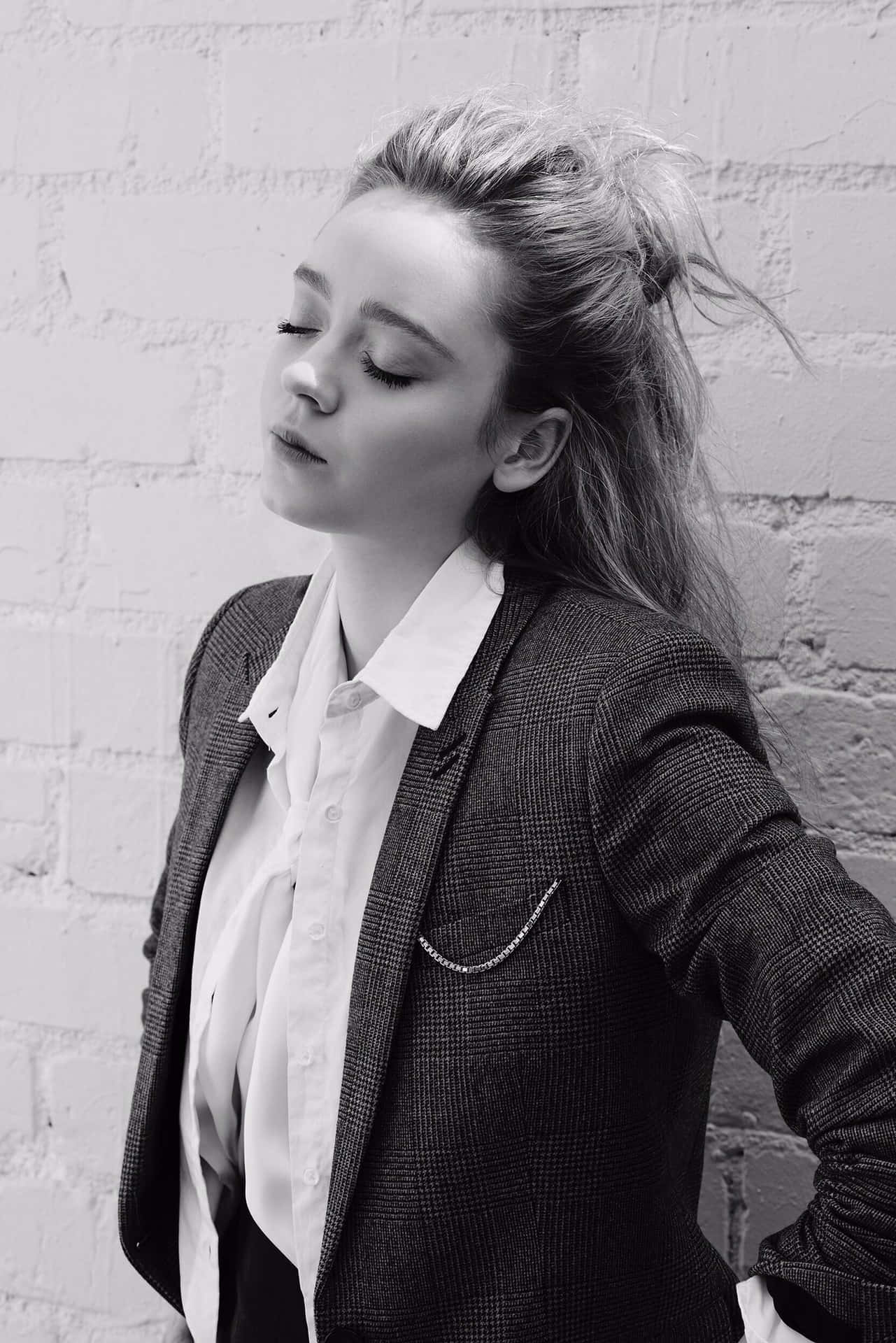 Monochrome Portraitof Woman Against Brick Wall Wallpaper