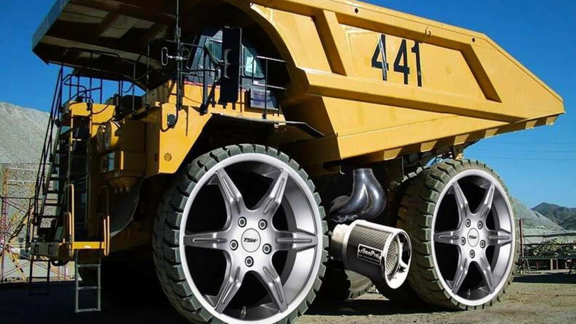 A Large Dump Truck With Large Wheels