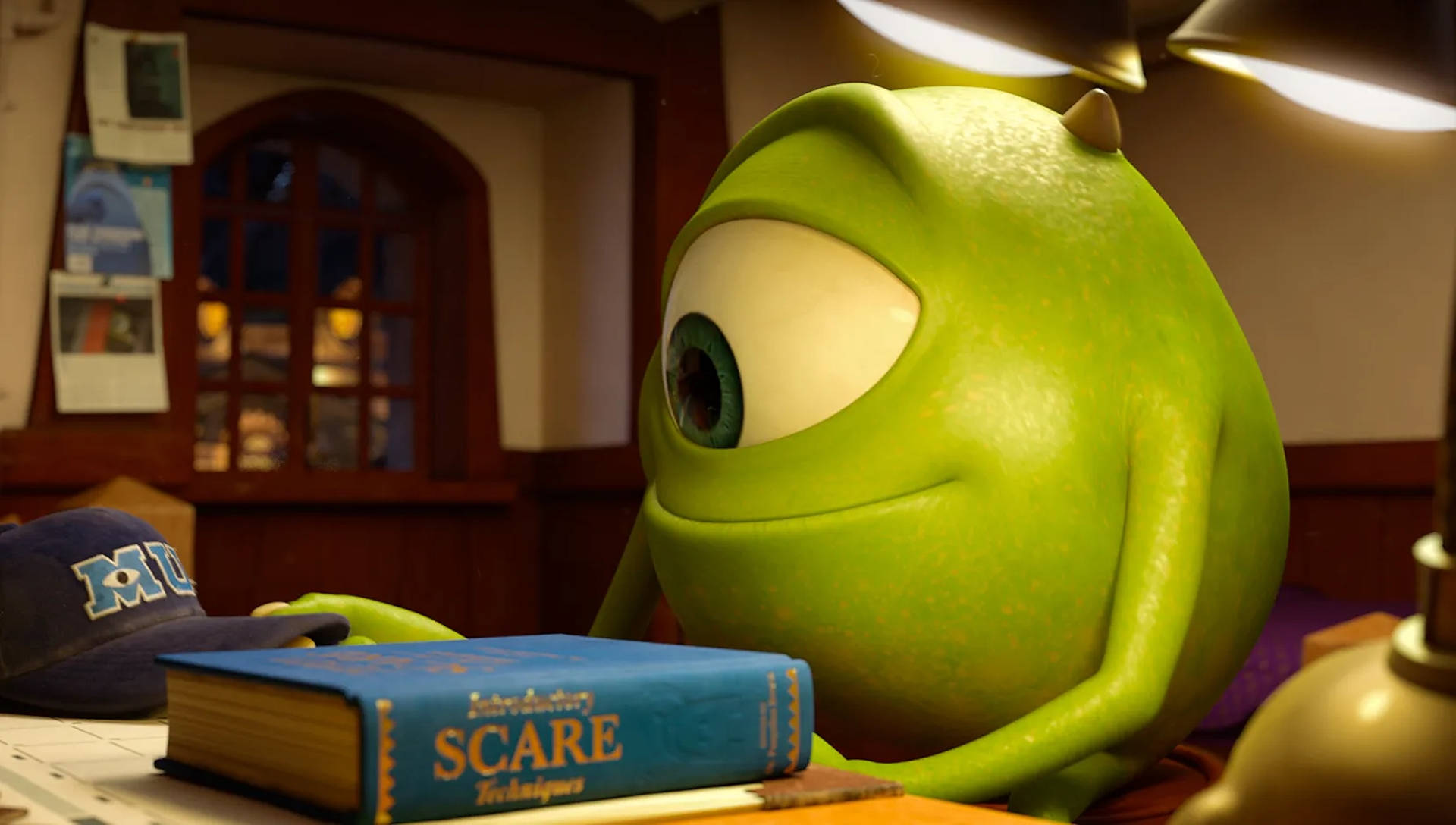 Passionate Mike Studying Hard at Monsters University Wallpaper
