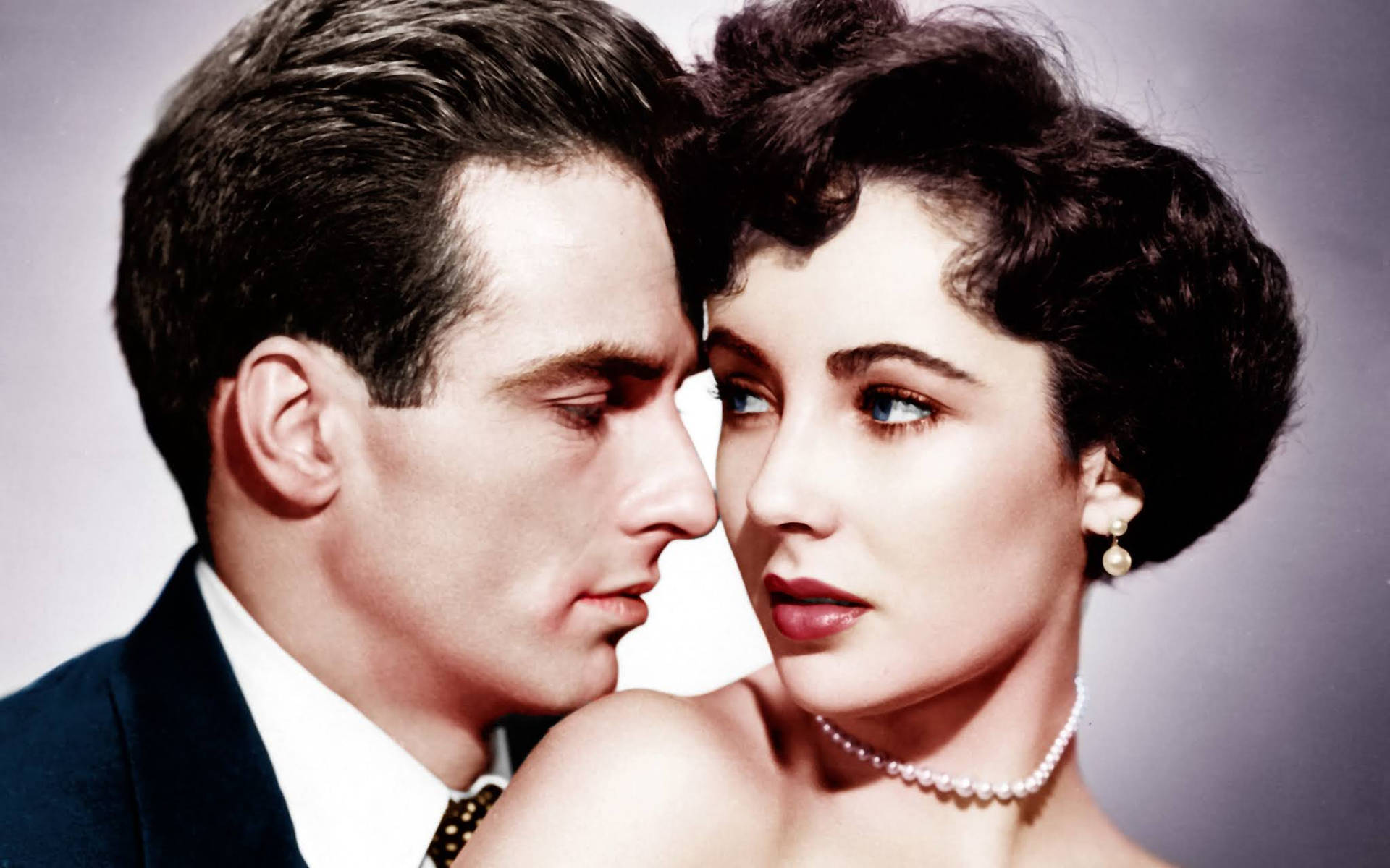 Iconic Hollywood Stars Montgomery Clift and Elizabeth Taylor in Deep Conversation Wallpaper