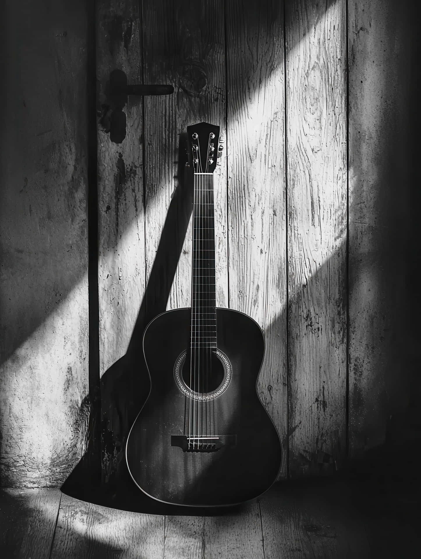 Moody Black And White Acoustic Guitar In Rustic Light Wallpaper