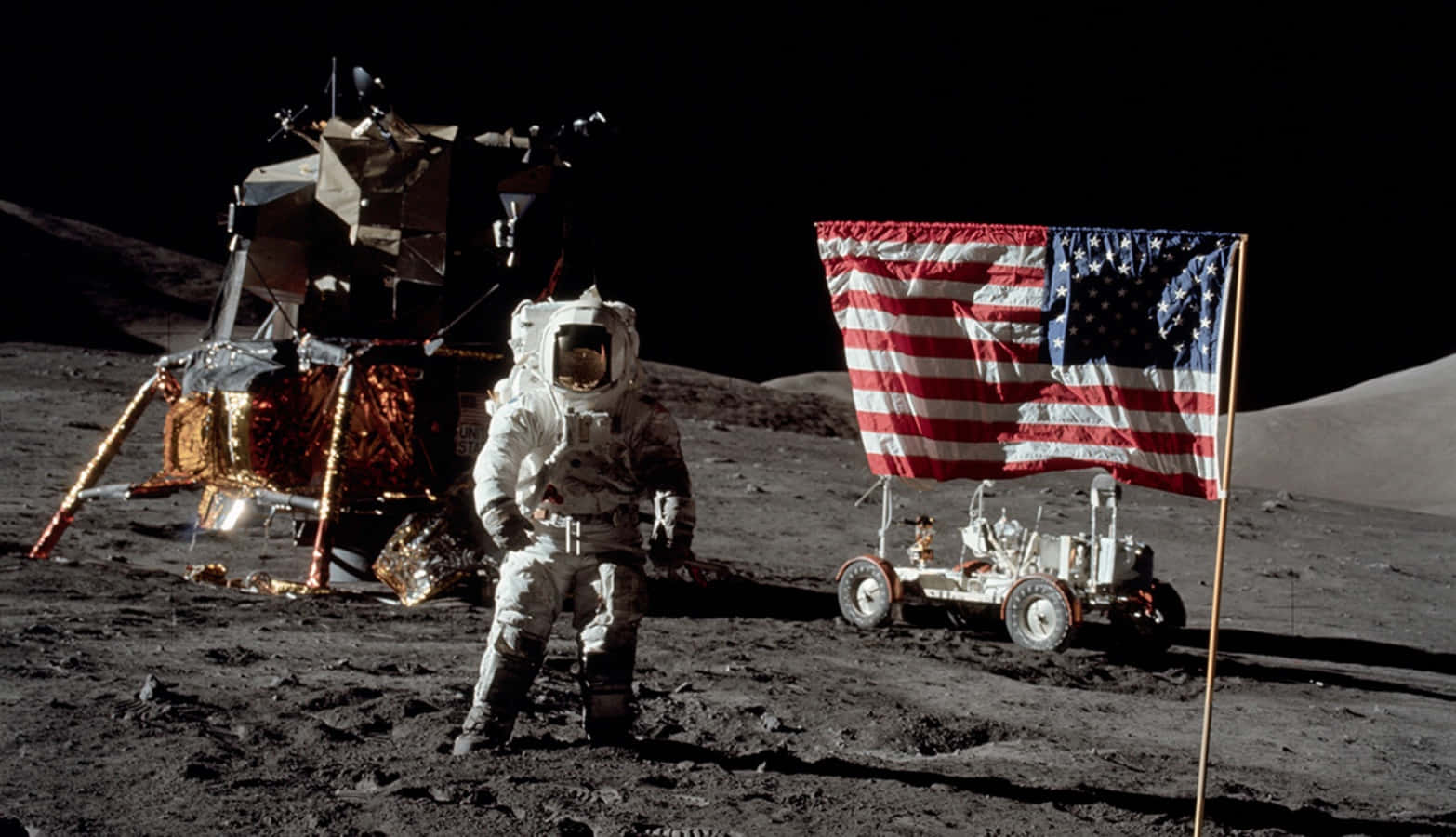 A Man Standing Next To A Flag On The Moon