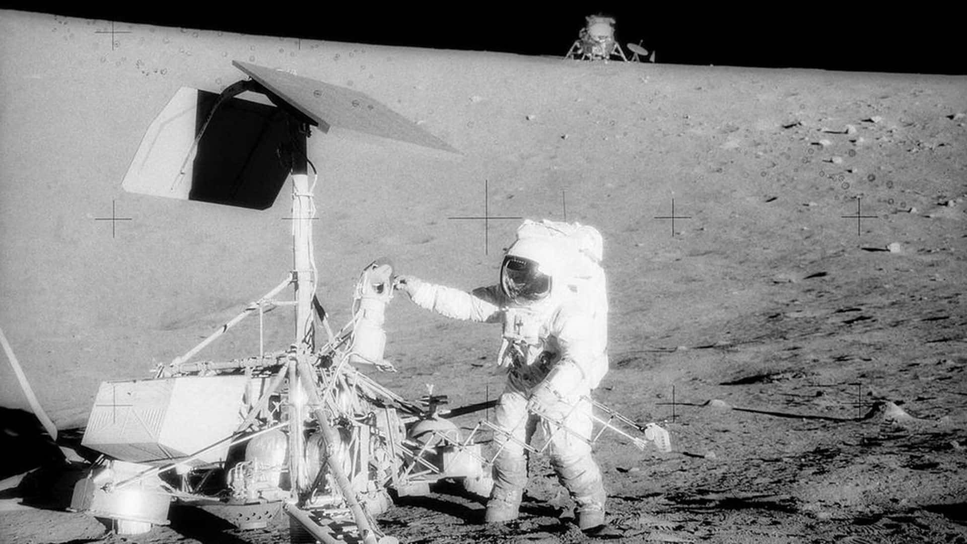A Man In A Spacesuit Is Standing On The Moon