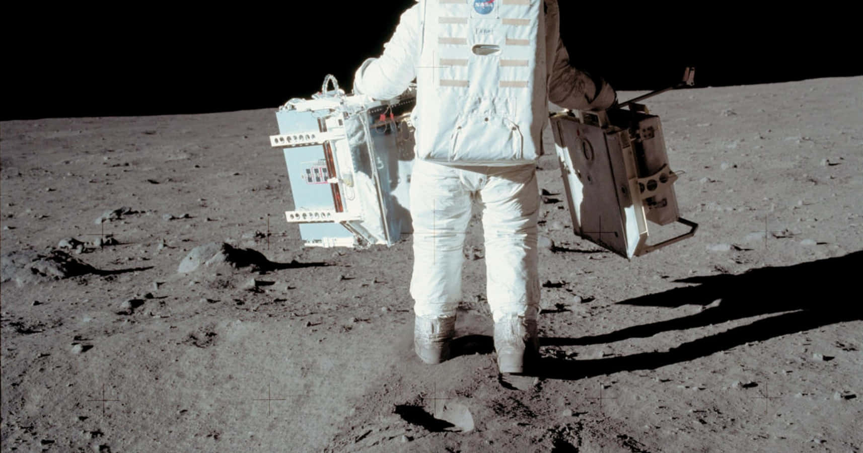 A Man In White Standing On The Moon With His Luggage