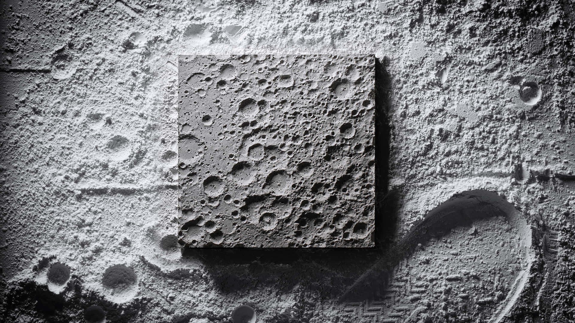 Billede af computer tapet med månens betonkrateret overflade