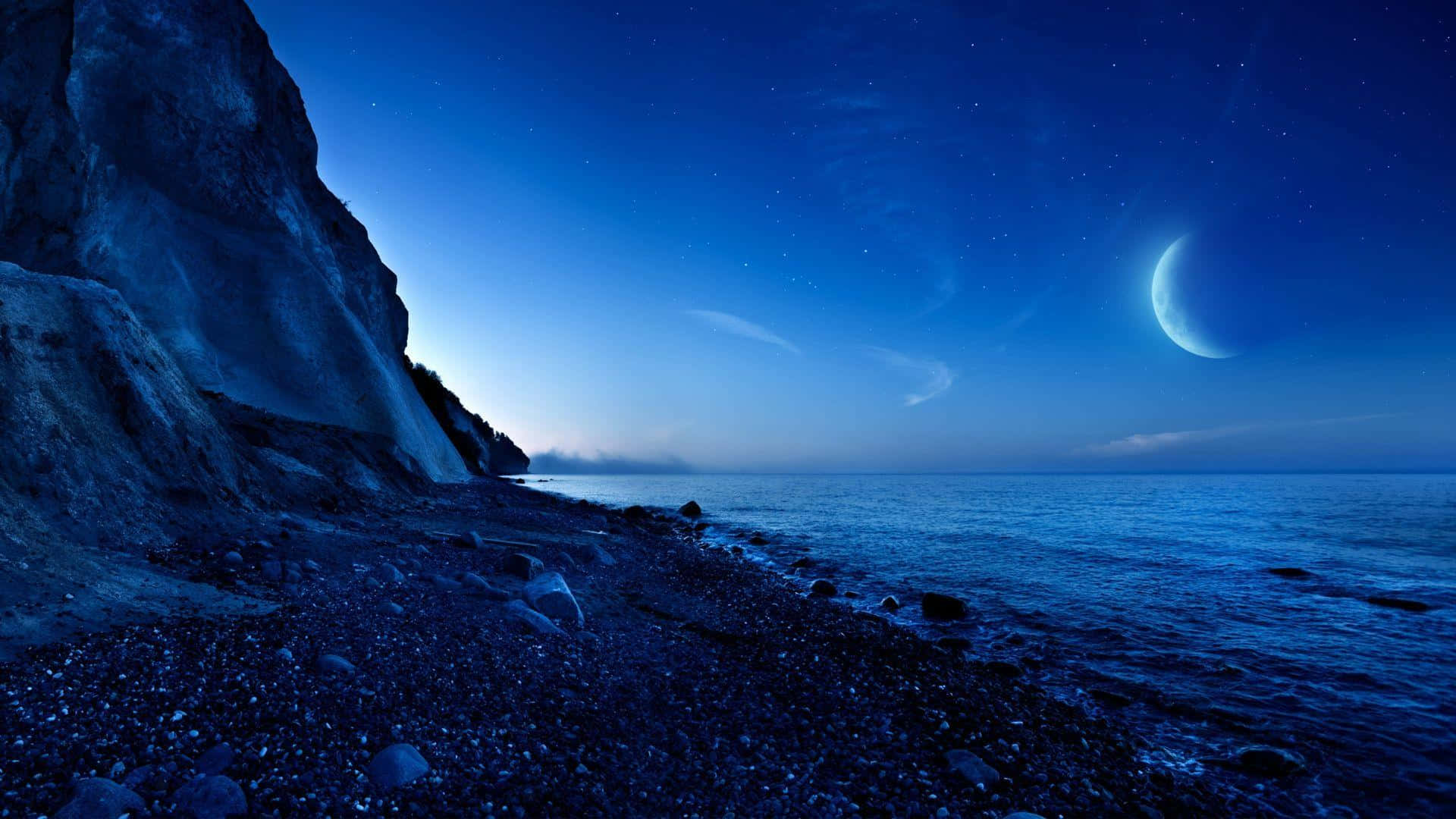 Moonlit Cliffside Beach Nightscape Wallpaper