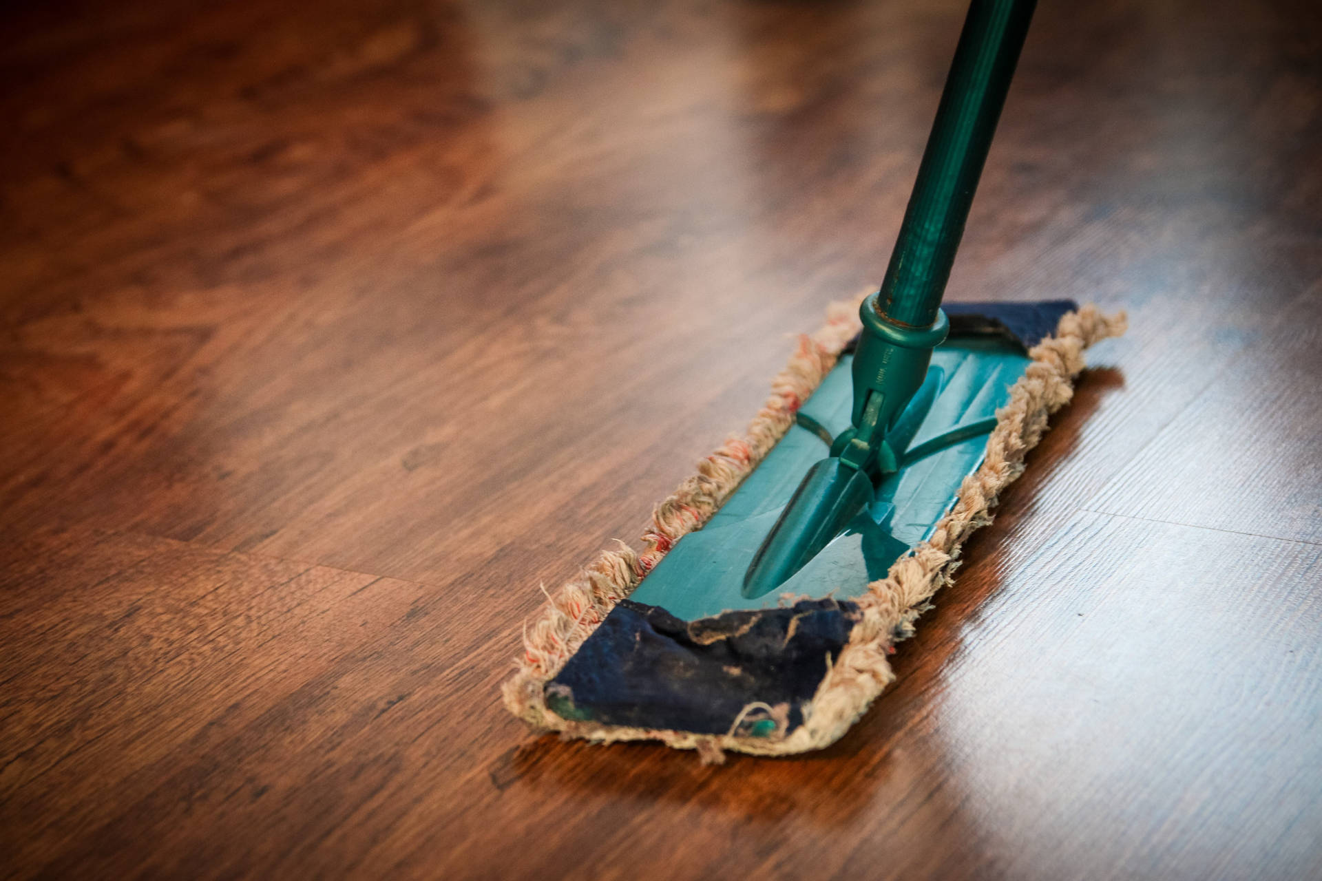 Mop On The Floor For House Cleaning Wallpaper