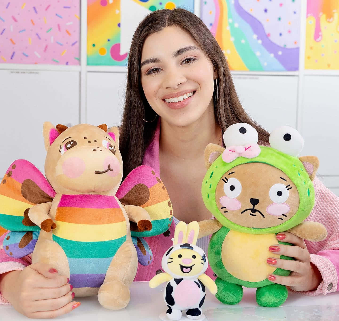 A Girl Is Holding Three Stuffed Animals Wallpaper