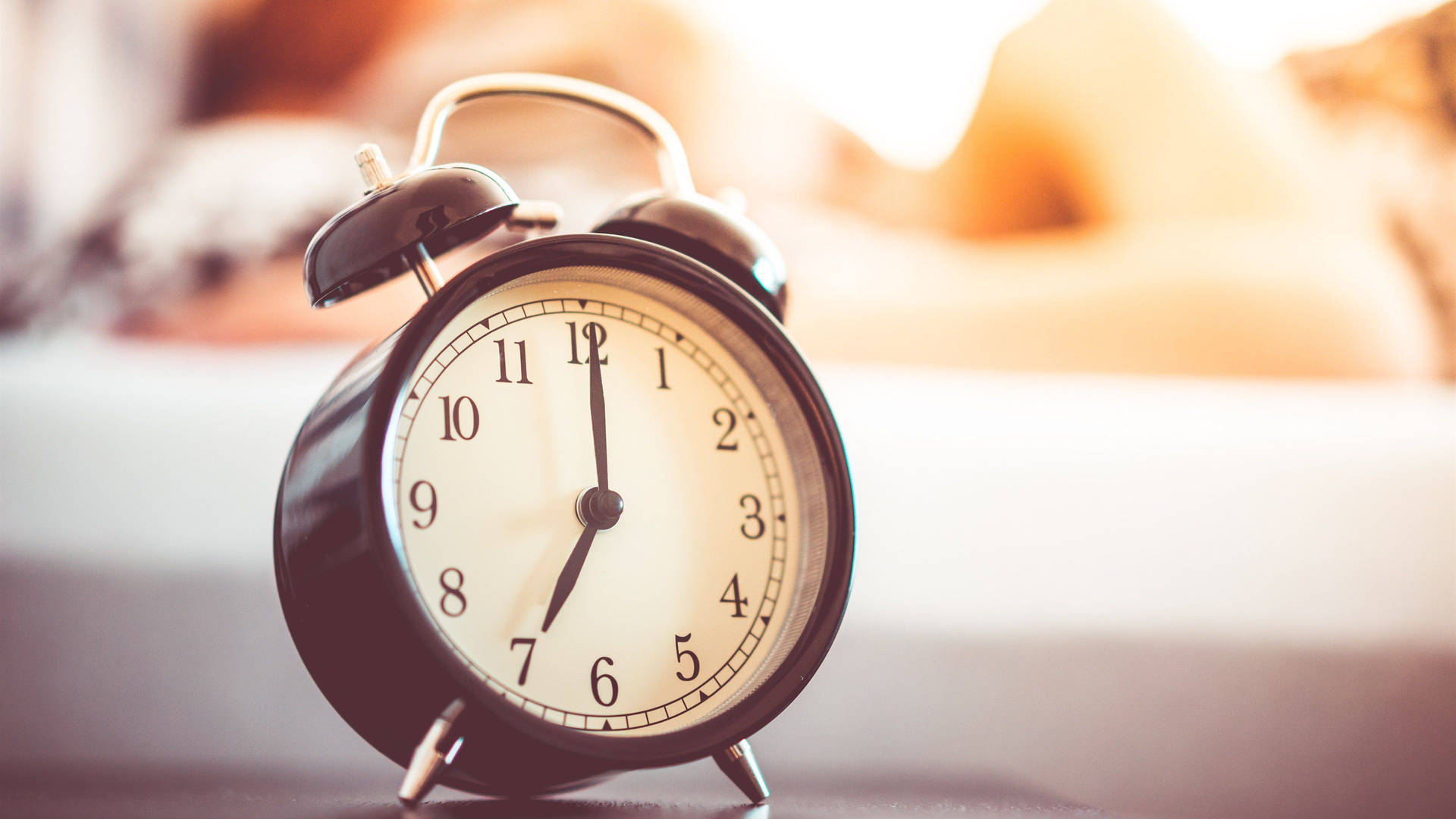 Classic Black Alarm Clock Signaling Morning Time Wallpaper