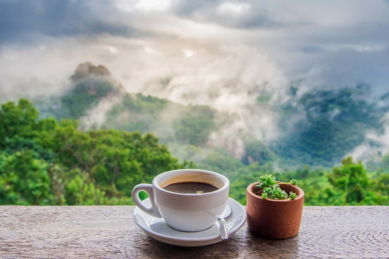 Coffee Cup On A Wooden Table With A View Of The Mountains