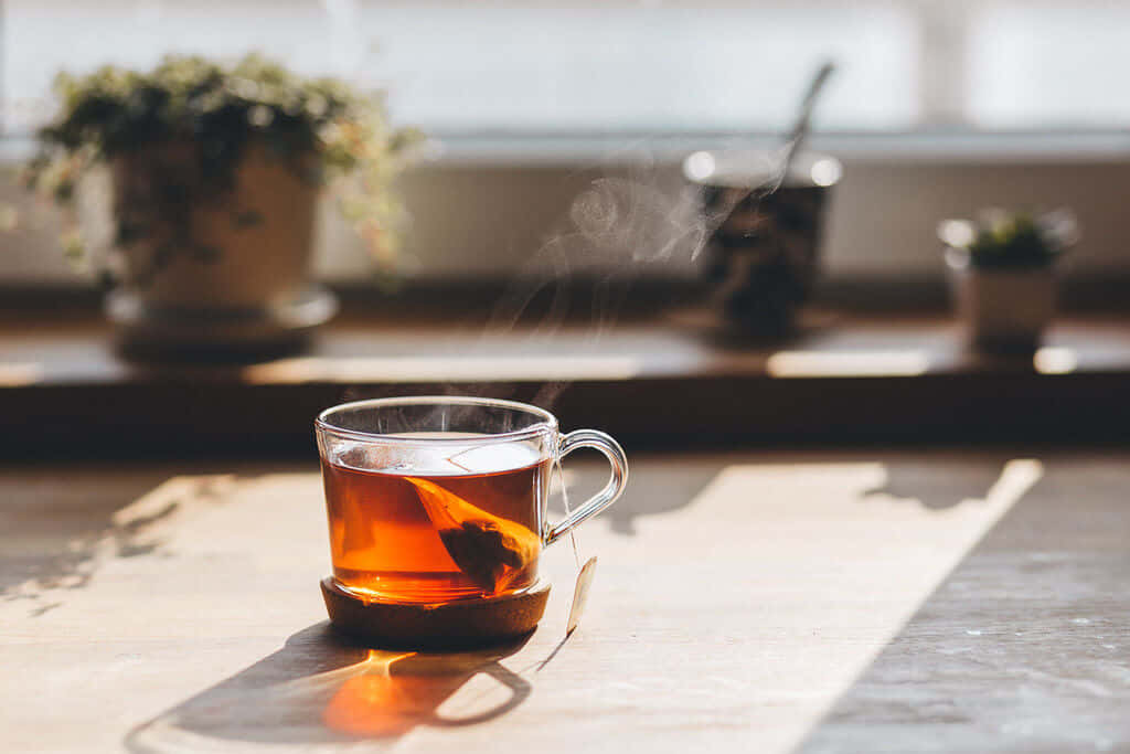 A Cup Of Tea On A Wooden Table