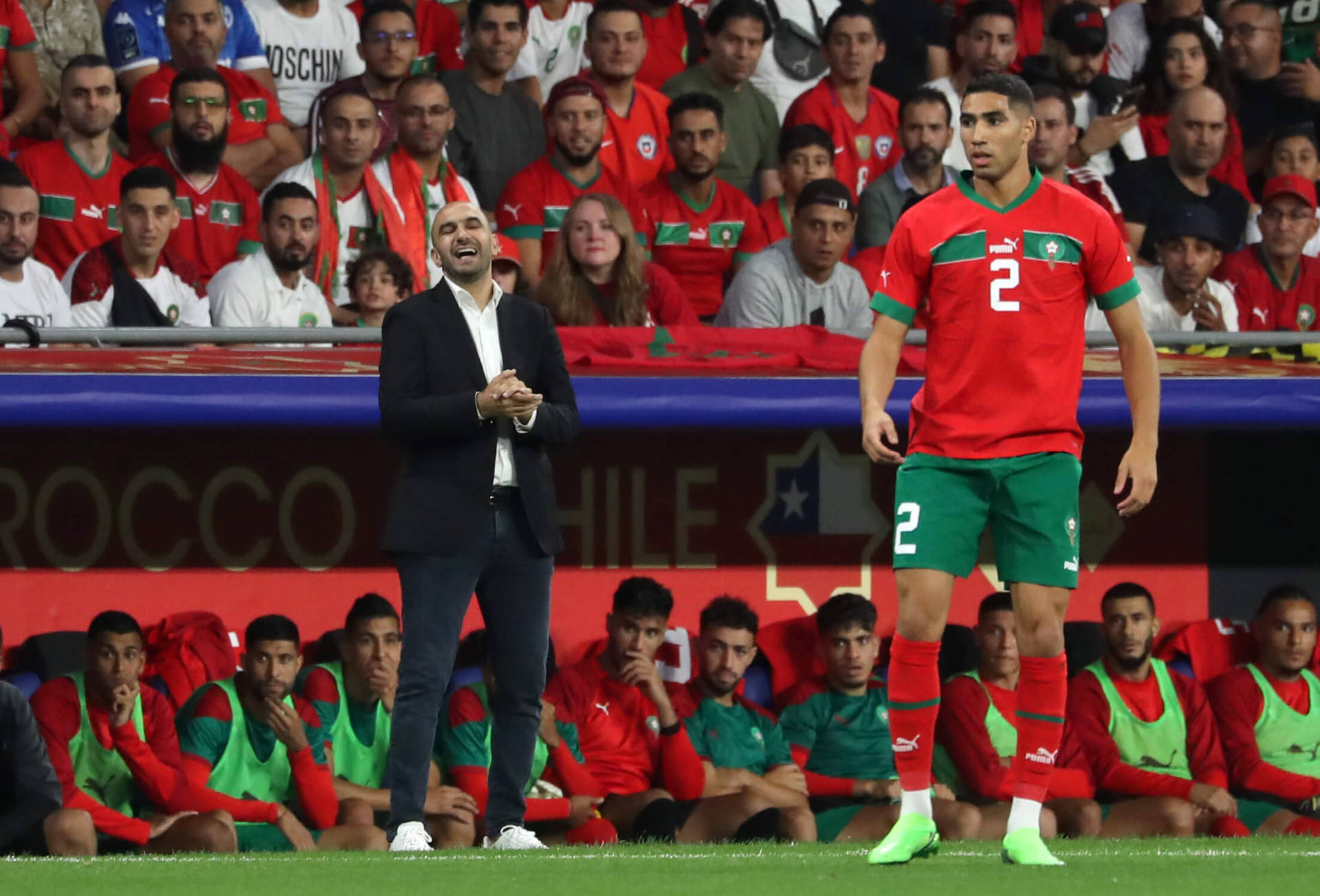 Morocco National Football Team Player With Man In Suit Wallpaper