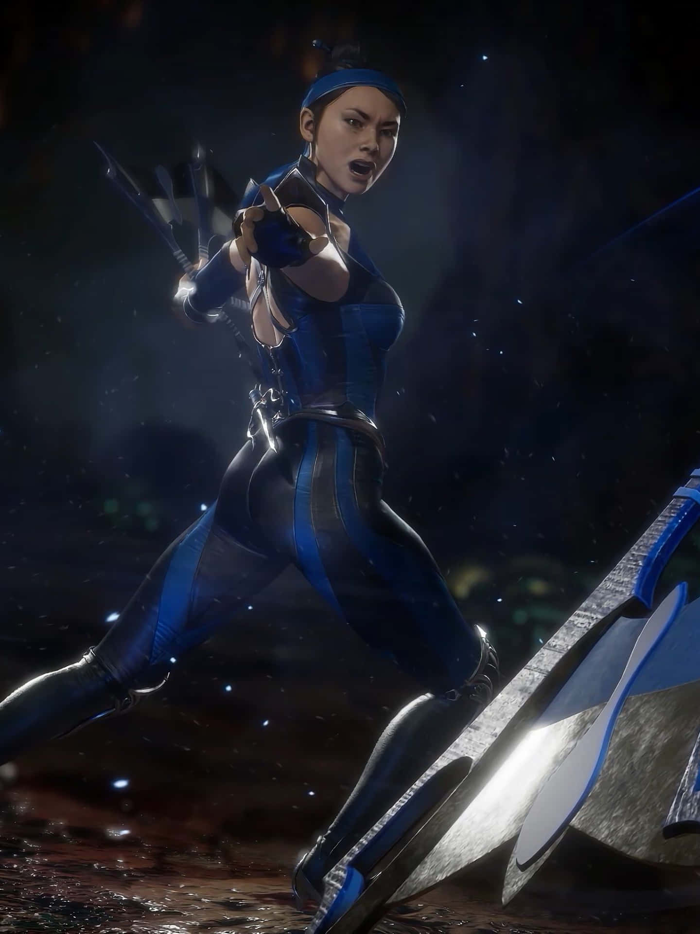 The fierce and skilled princess, Kitana, wielding her iconic fans in Mortal Kombat. Wallpaper