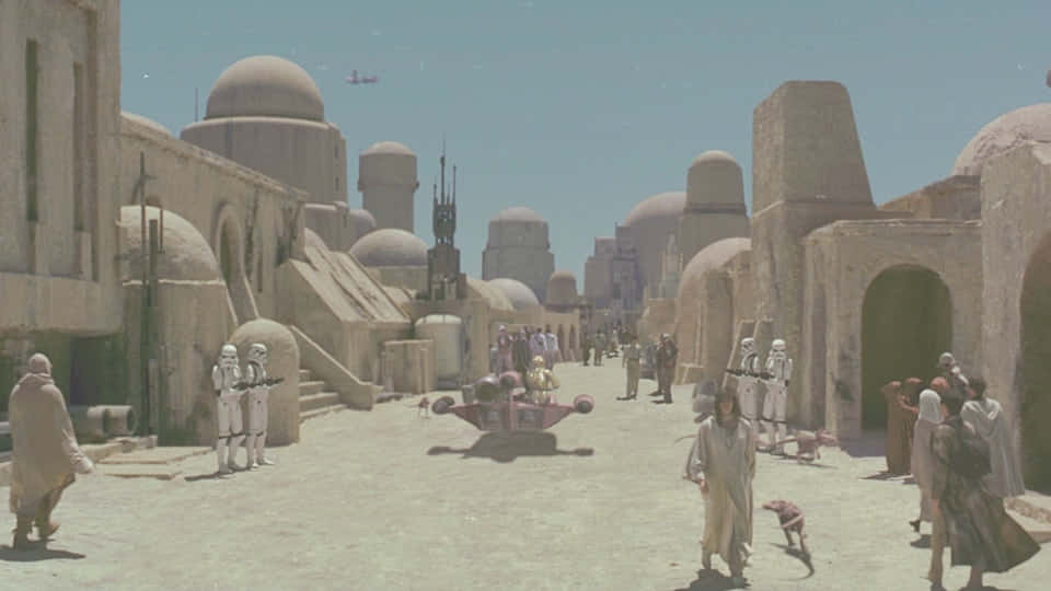 The bustling port of Mos Eisley, resting on the planet Tatooine Wallpaper