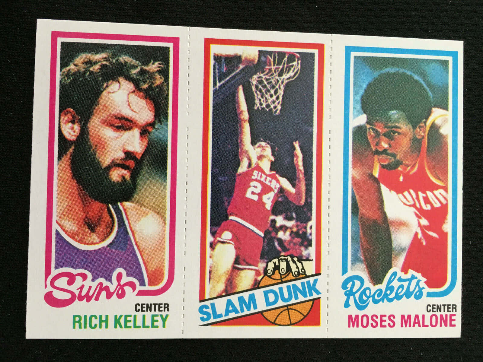Moses Malone and Rich Kelley in a heated basketball match Wallpaper