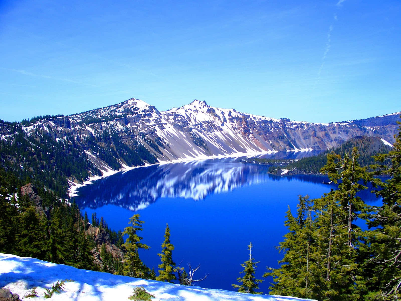 A Blue Lake In The Mountains Wallpaper