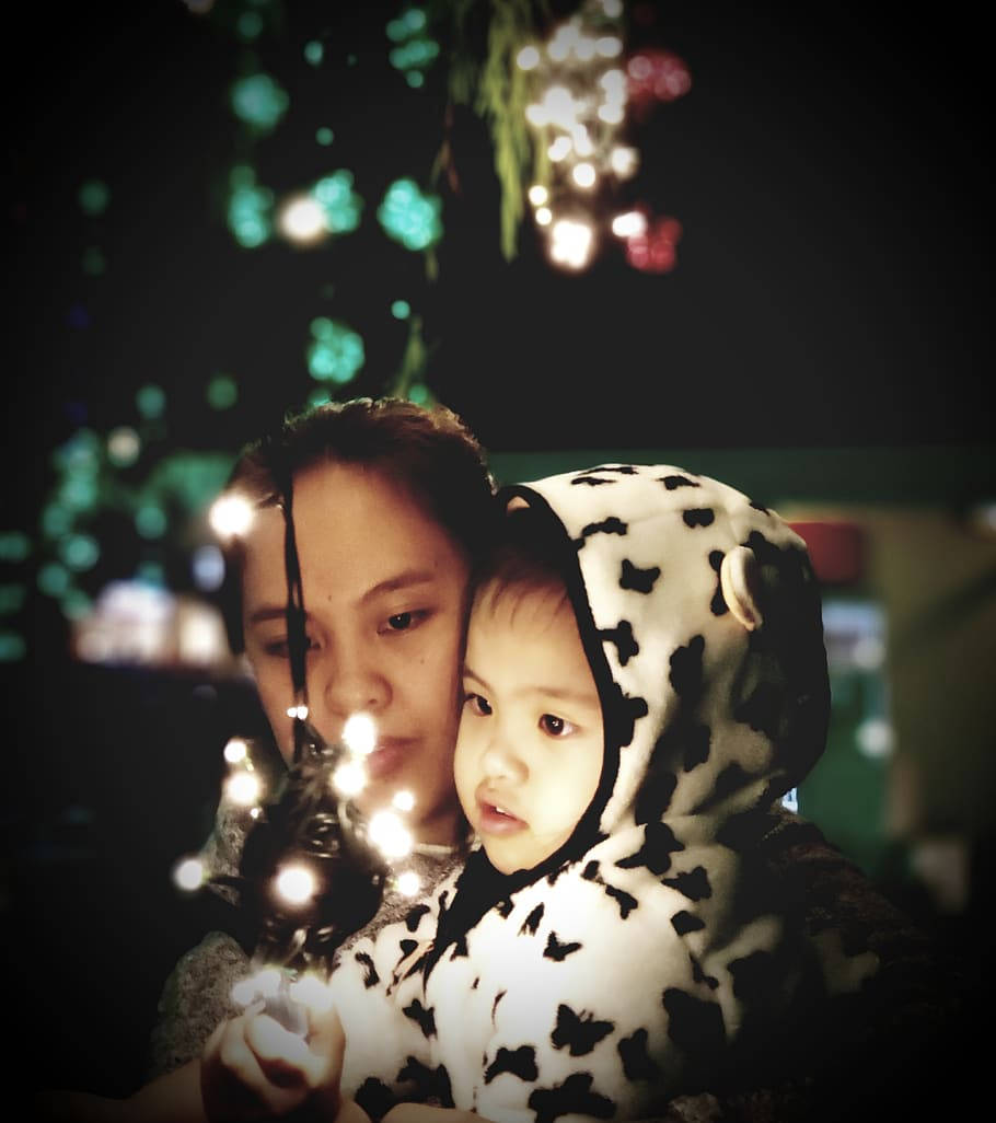 Mother And Baby With Fairy Lights Wallpaper