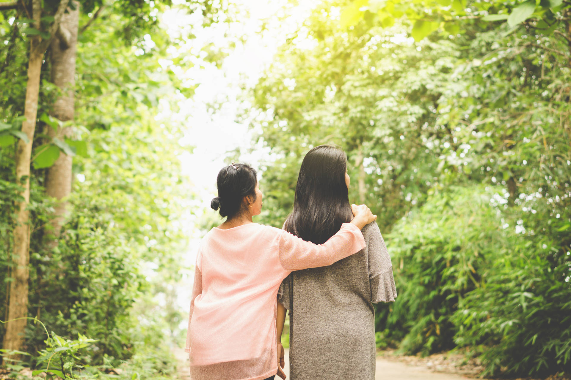 Mother And Daughter Forest Stroll Wallpaper