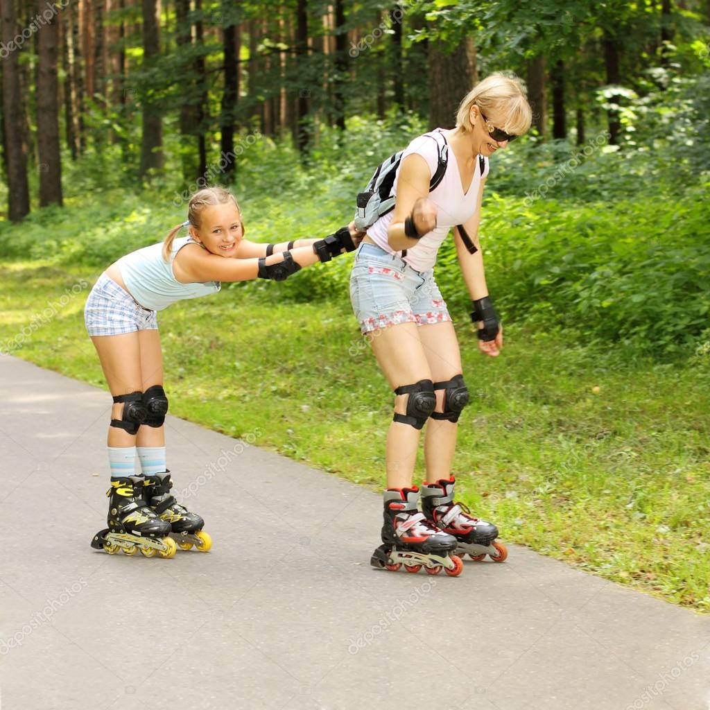 Mother And Daughter Rollerblading Bonding Wallpaper