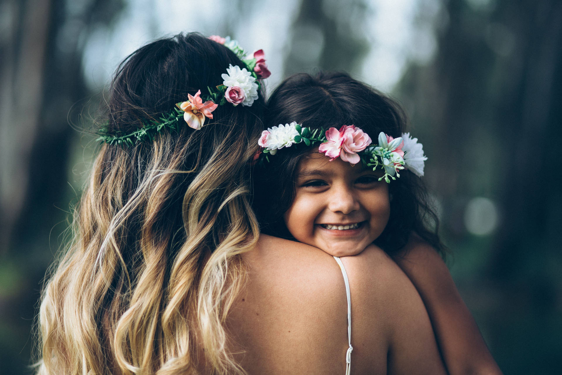Mother And Daughter Wearing Flower Crown Wallpaper