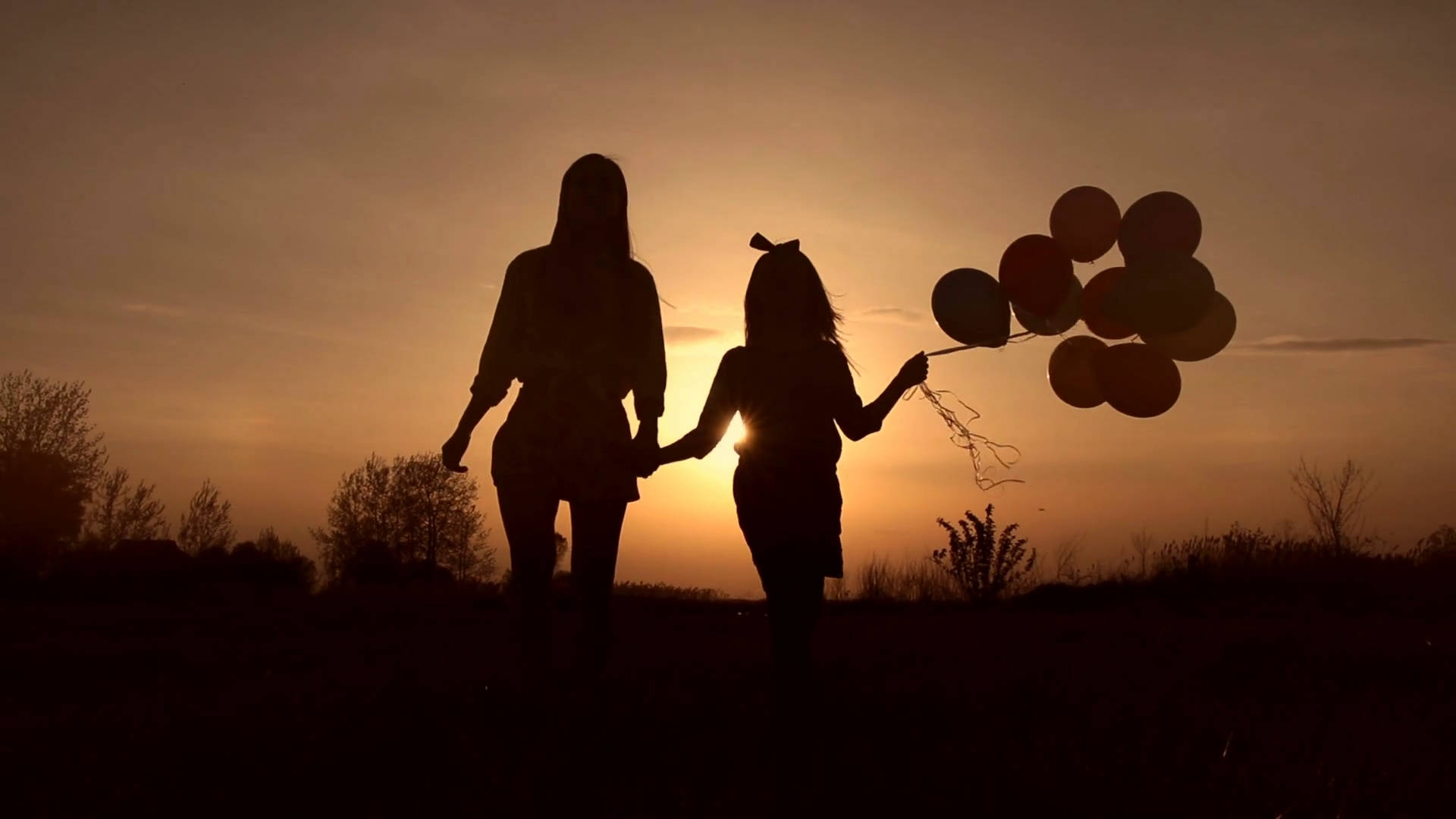 Mother And Daughter With Balloons Wallpaper
