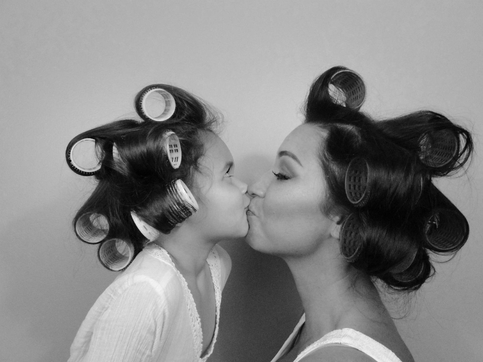 Mother And Daughter With Curlers Wallpaper