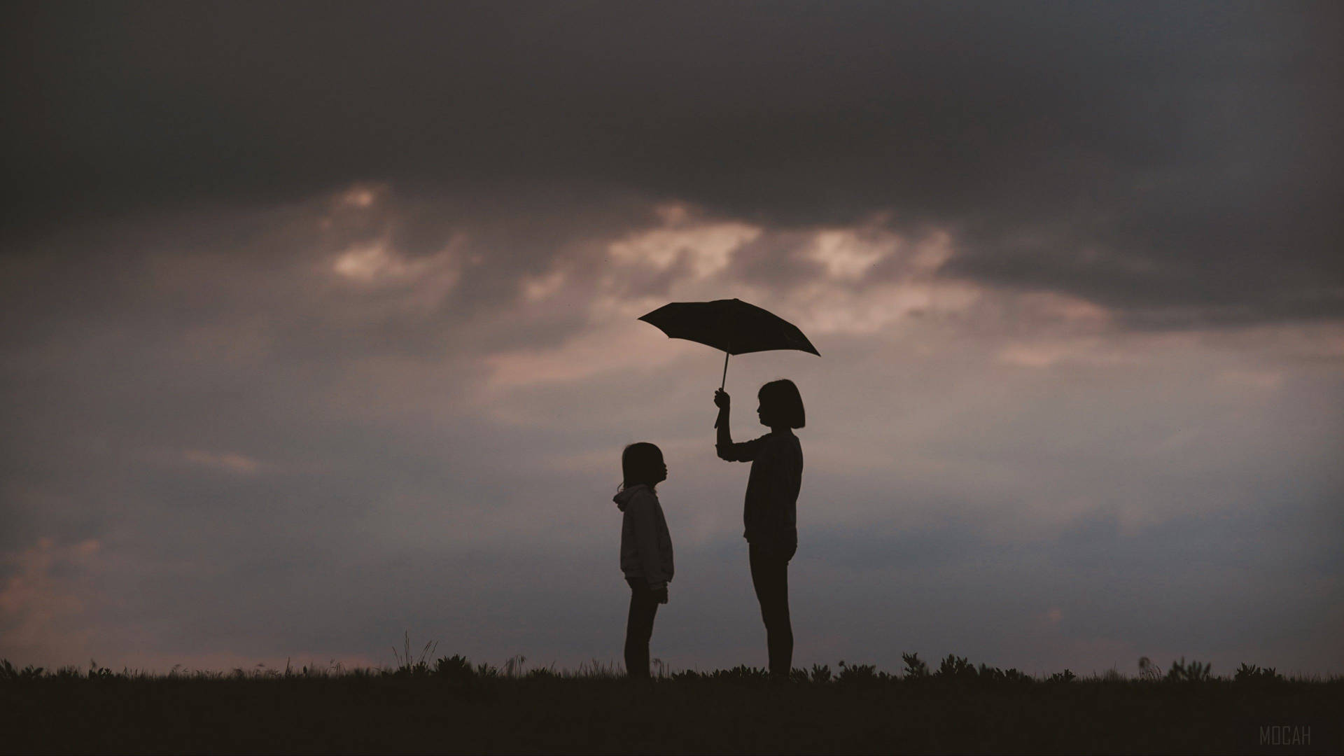 Mother And Daughter With Umbrella Wallpaper