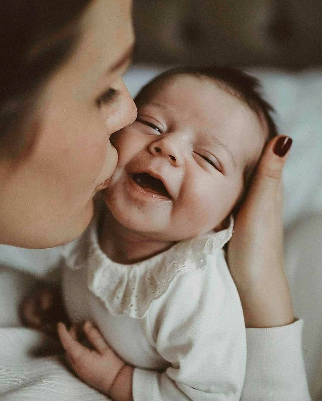 Mother And Lovely Smiling Baby Wallpaper
