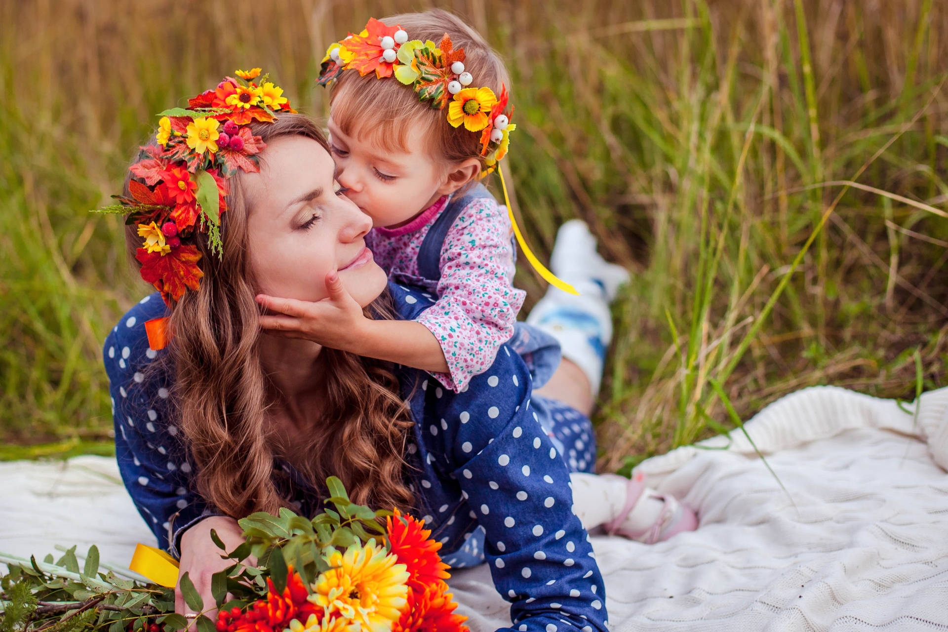 Mother And Son With Colorful Flowers Wallpaper