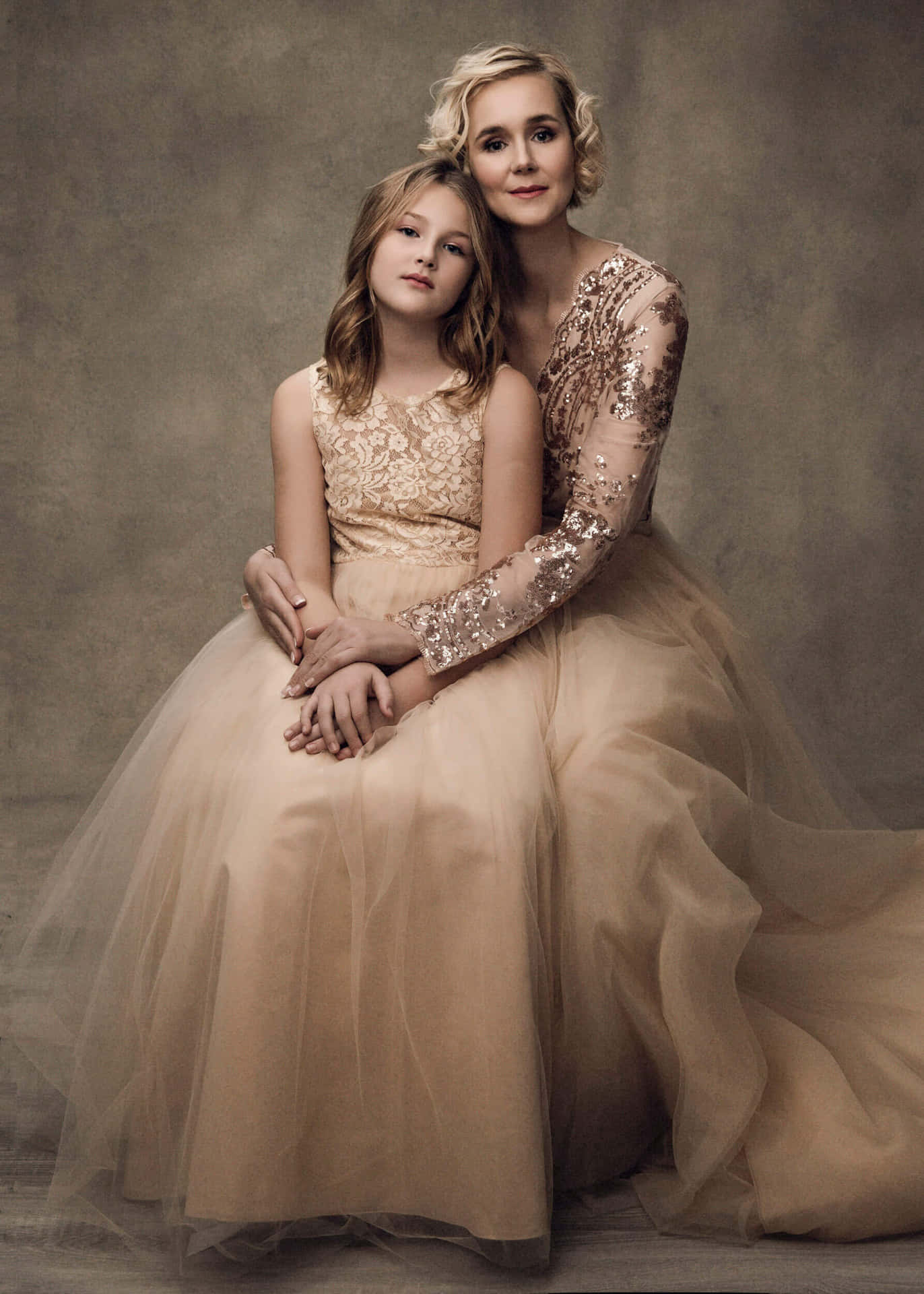 A Woman And Her Daughter In A Golden Dress