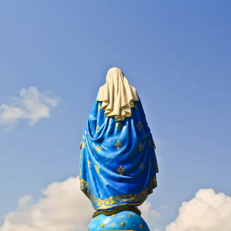 A Blue Statue Of The Virgin Mary