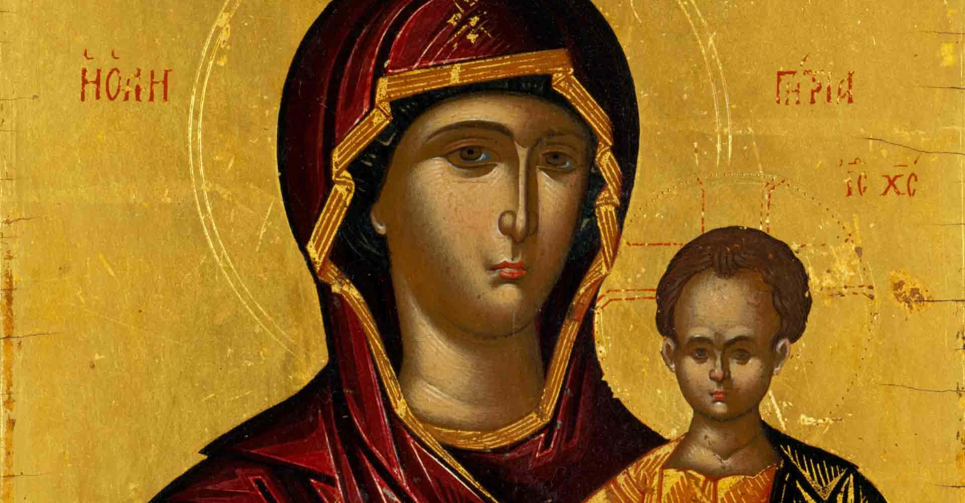 A Gold Colored Icon Of The Virgin And Child