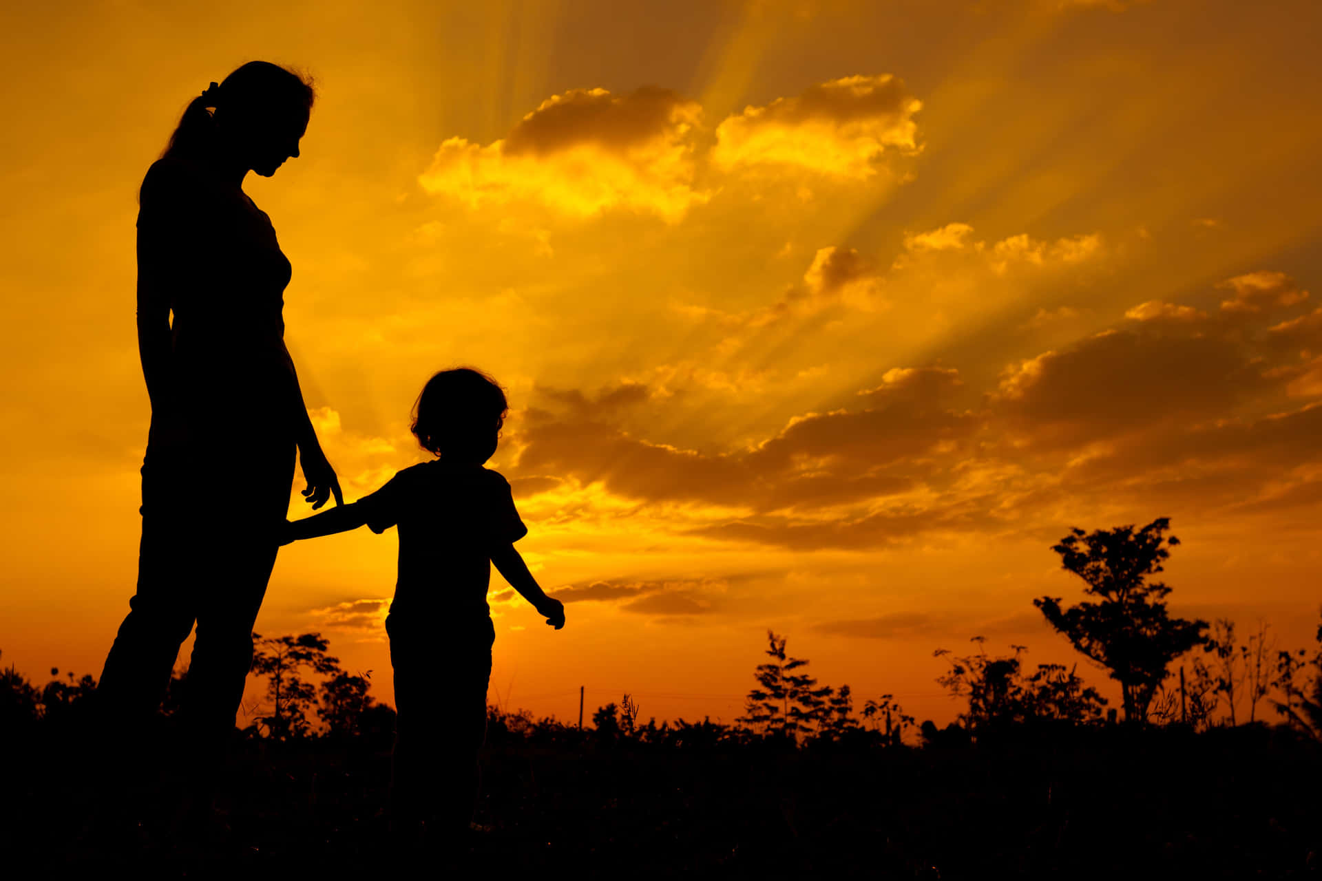 Mother And Baby Against Orange Sky Picture