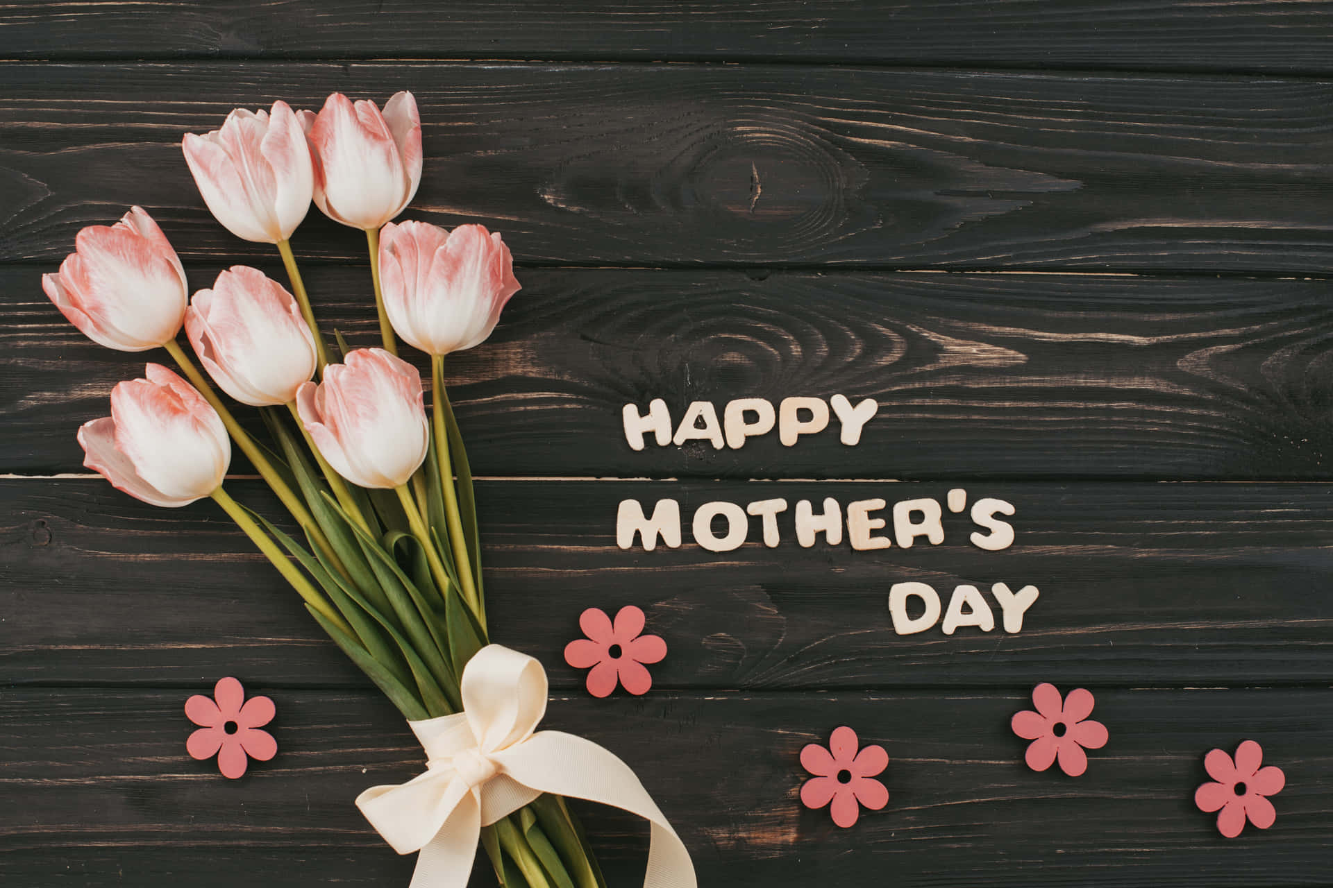 Happy Mother's Day With Pink Tulips On A Wooden Background