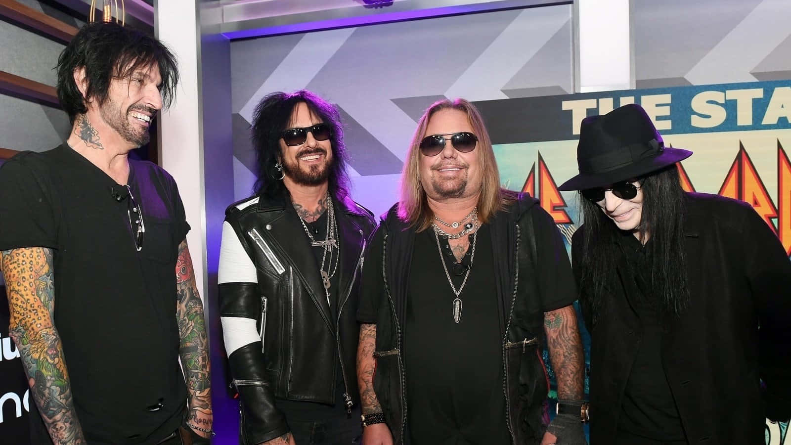 Motley Crue rocks their fans with an unforgettable performance Wallpaper