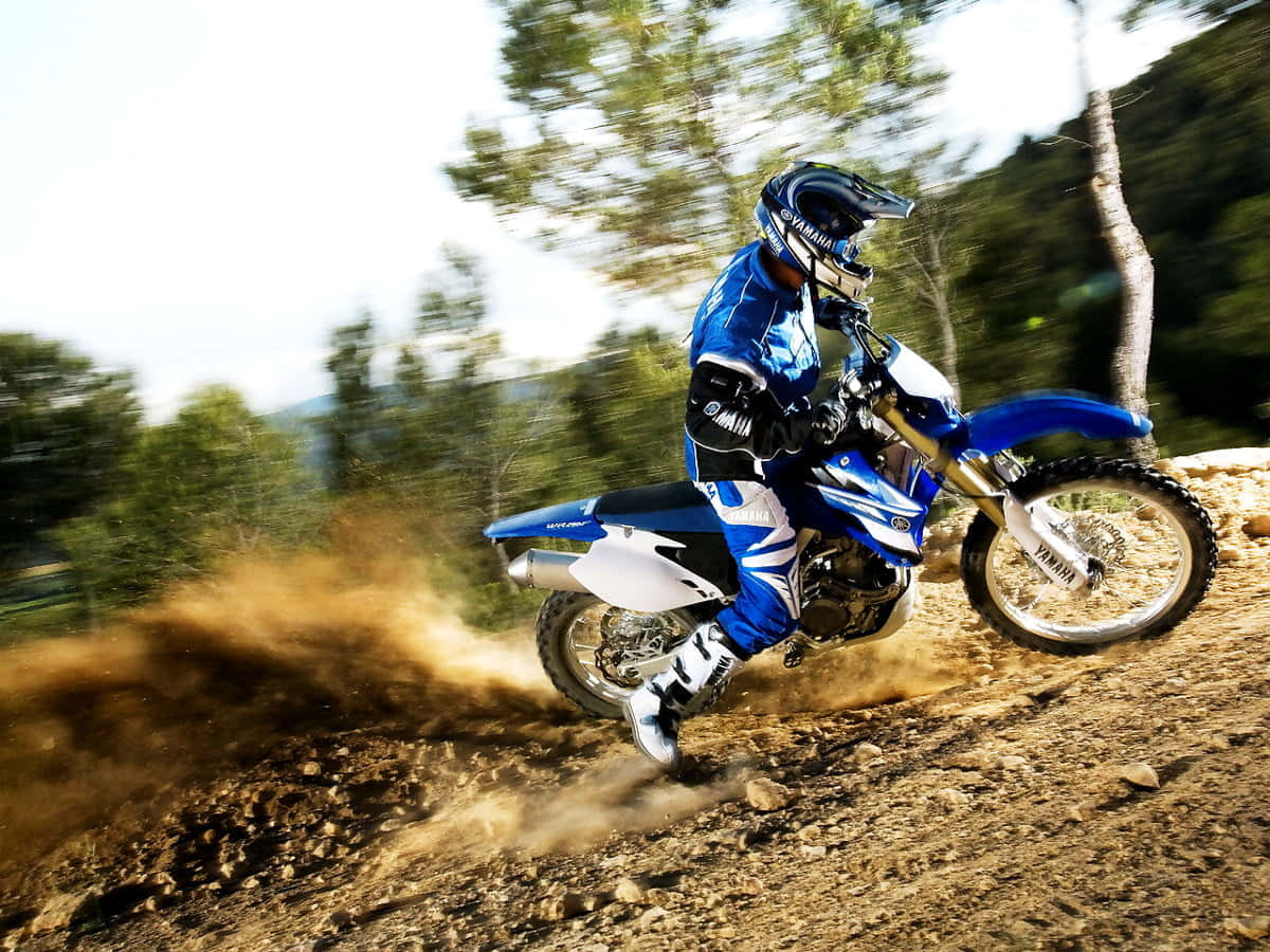 Motocross rider catching air during a race