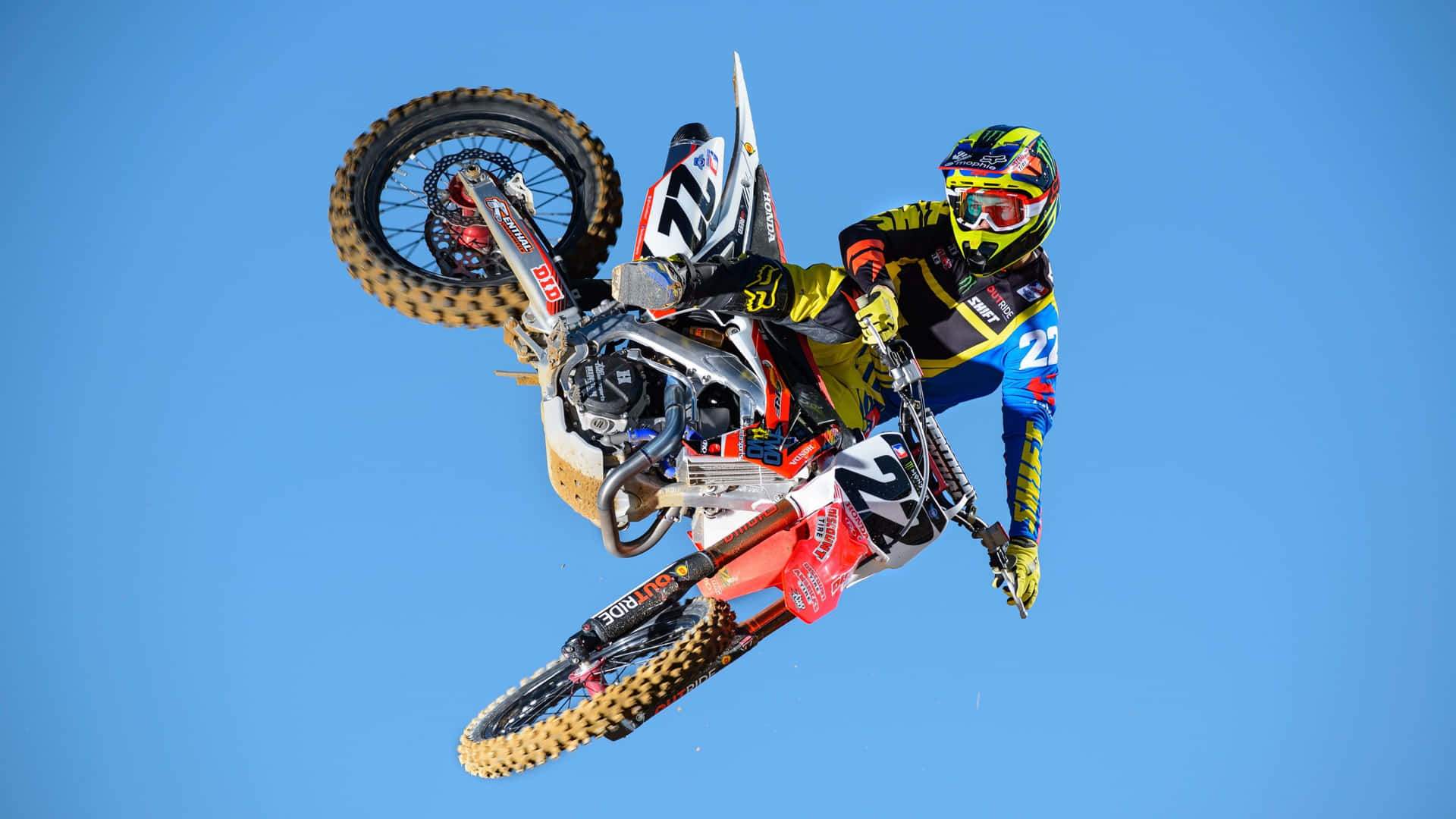 Motocross rider soaring through the sky