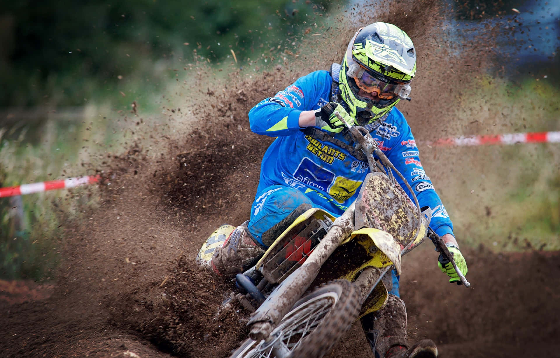 Motocross rider conquering rough terrain on a dirt bike