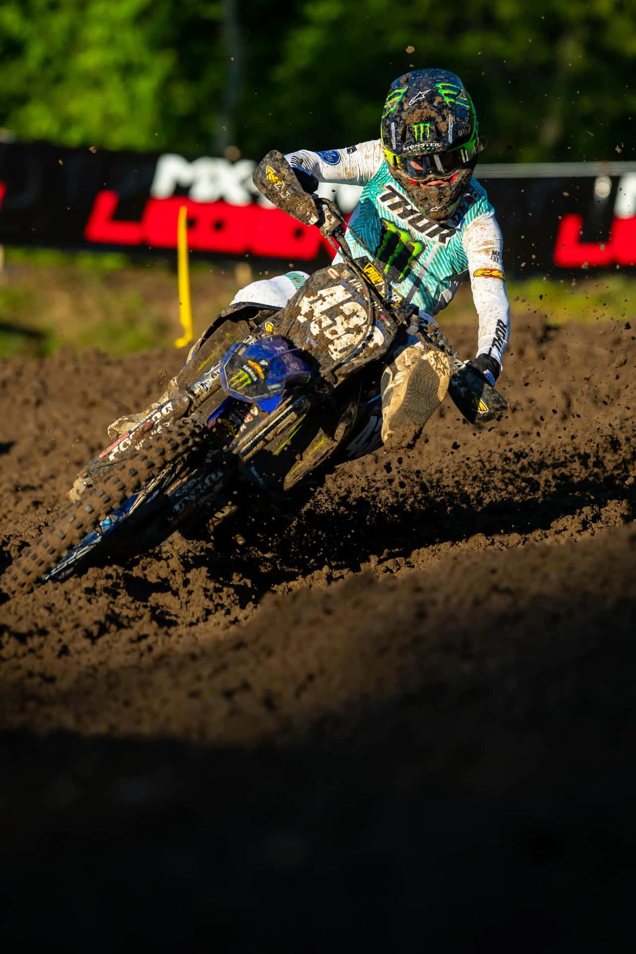 Motocross Racer Cornering Intensely Wallpaper