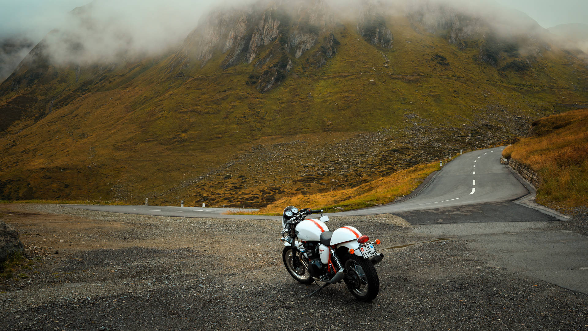 Motorcycle Parked Near Mountains Wallpaper