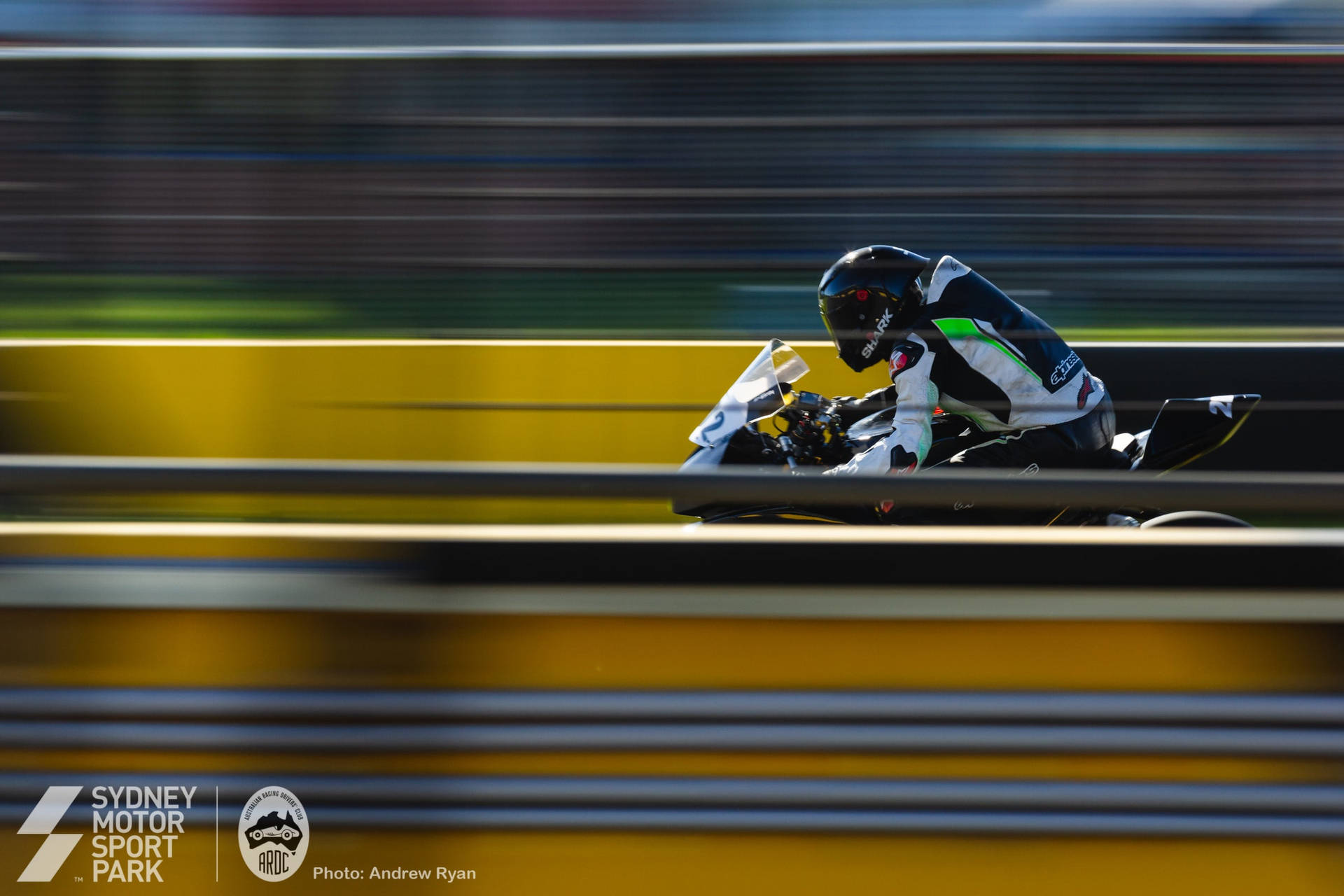 Motorcycle Rider In Sydney Motorsport Park Wallpaper