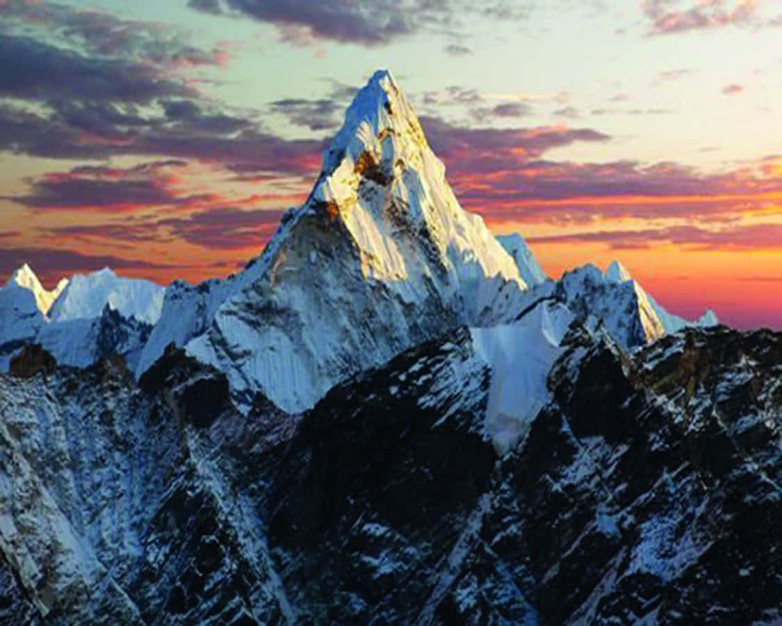 A Mountain Peak Is Seen At Sunset