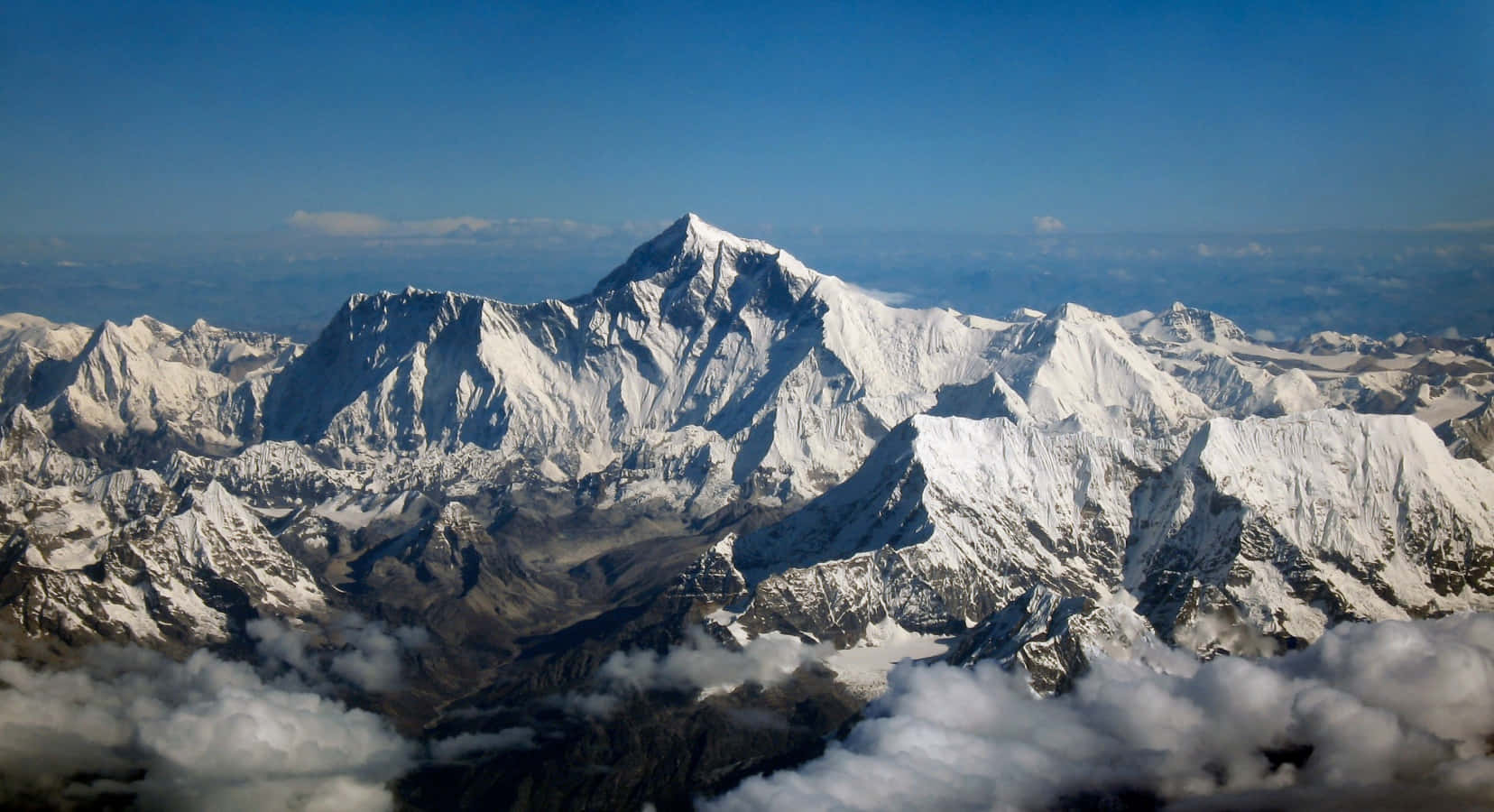__ Spectacular view of Mt. Everest rising majestically above the clouds