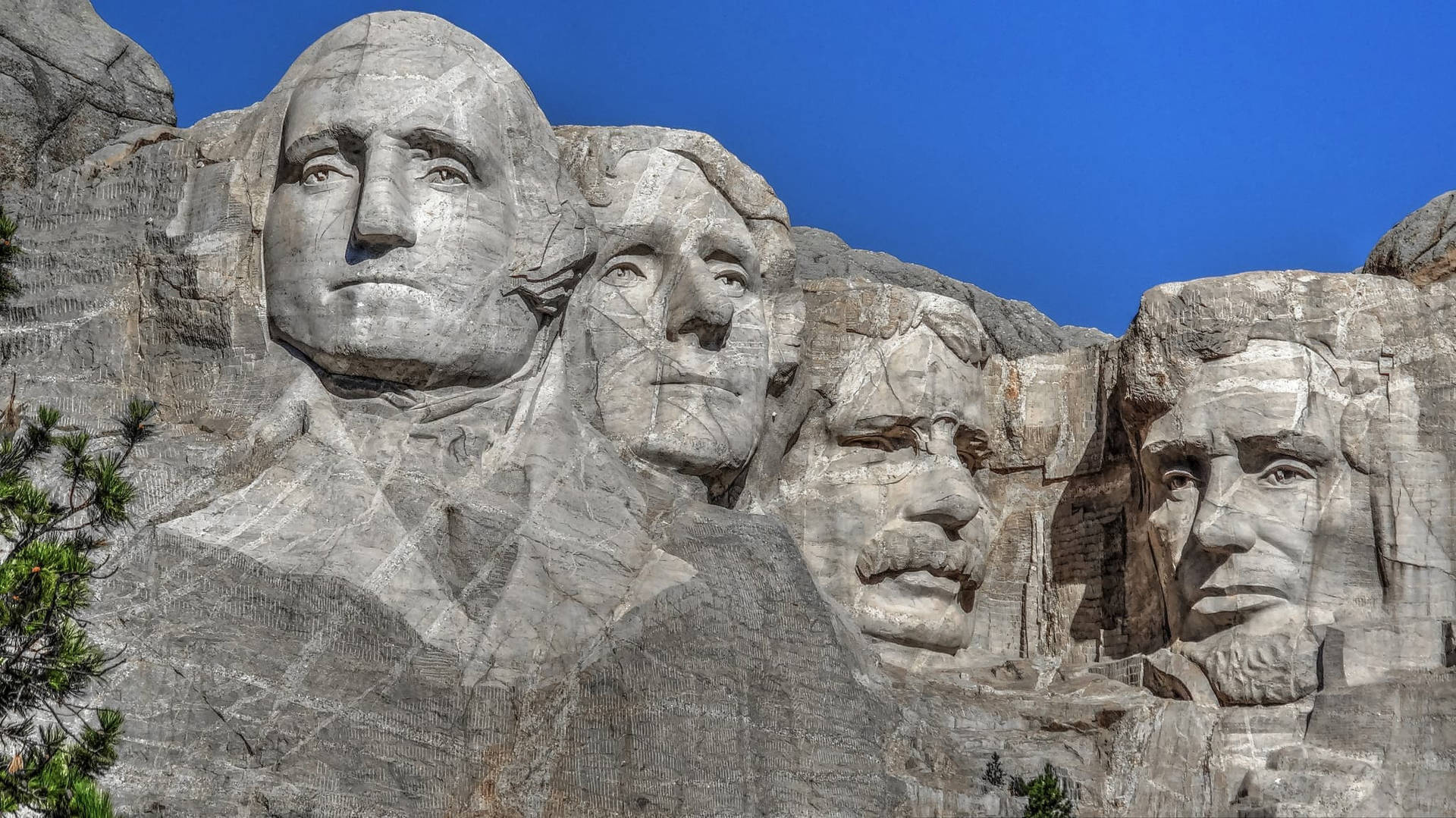 Esculturadel Monte Rushmore En Un Día Despejado Fondo de pantalla